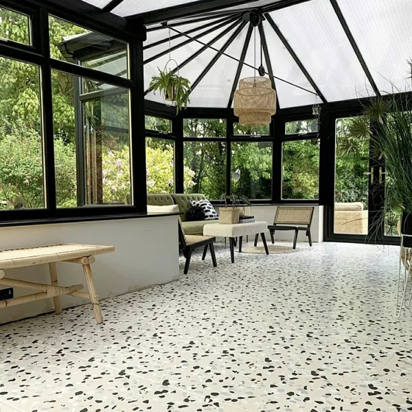Bright sunroom with bold black and white terrazzo in Hotels