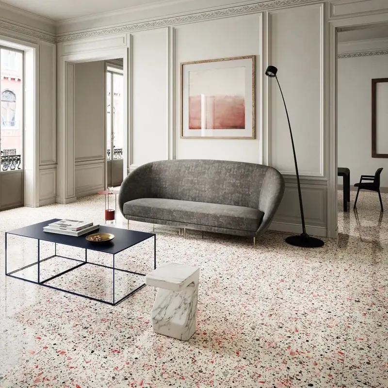 Elegant lounge with grey sofa and pink-flecked terrazzo