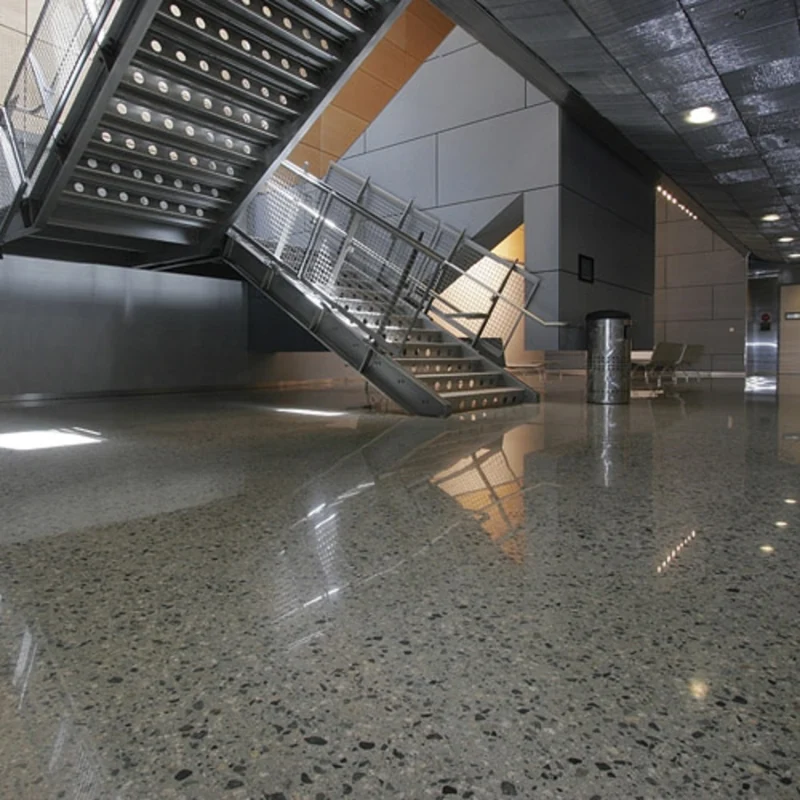 Industrial metal stairs on polished grey terrazzo