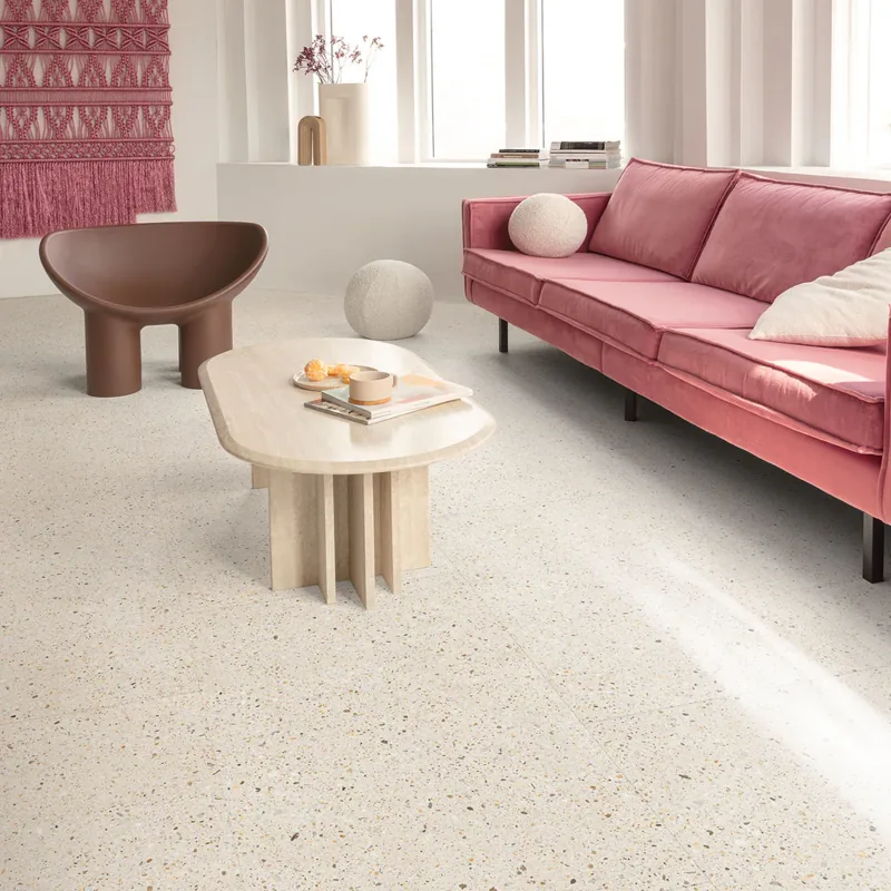 Pink sofa on light cream terrazzo living room floor