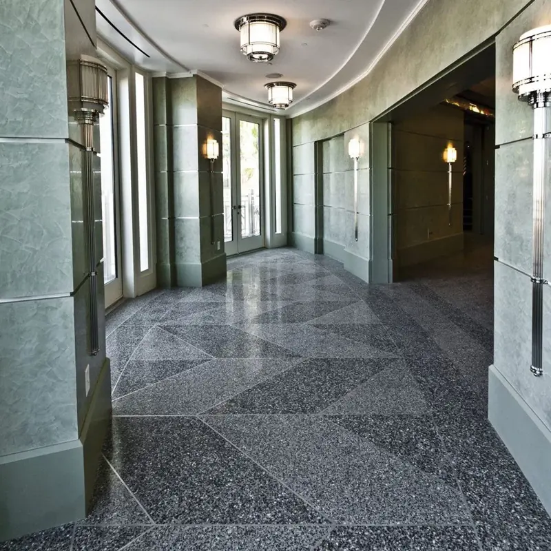 Upscale hallway with grey geometric terrazzo designs